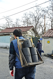 Distribution of coal briquettes to needy families in Korea